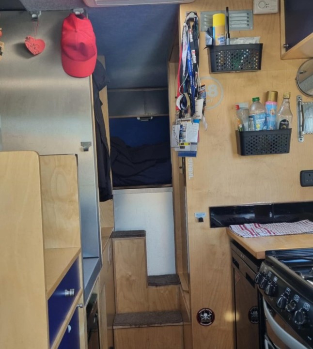 Story from Jam Press (Frugal Van Life) Pictured: The inside of the van they live in. 'I sold my three-bed after painful break-up and moved into a VAN to live off-grid ? now I spend just ?250 on bills and love the simple life' A man has revealed how he sold his three-bed house after a painful break-up to move into a van ? now spending just ?250 a month on bills while travelling around Europe. When James Ruddick split with his other half, he had just ?2.67 in his bank account and was ?18,000 in debt. Looking around his three-bed house, where he had lived with his partner of 15 years, he decided it was time for a change. The Brit was also fed up with the UK?s cost of living crisis ? which saw him constantly paying bills and never having anything left over to enjoy his life. So he put his house on the market, sold all his belongings and moved into a van. ?I had a lovely three-bed house,? the 50-year-old from Carlisle told What's The Jam. ?It really was nice, but I thought, why am I paying all of this to be in a three-bed house with just a dog and not have any money left at the end of the month? ?About five years ago, a relationship ended that had lasted almost 15 years. ? That left me with ?2.67 in the bank and ?18,000 worth of debt. ?The house had to be sold, which paid off almost all of the debt, but not all of it. ?I bought several houses, renovated them and sold them but the work I was doing at the time went completely wrong. ?The whole thing fell apart. ?It was a combination of things that made me stop and reassess everything I was doing. ?All my wages were gone by the end of each month. ?I had a van for years that my ex and I used to go away [on long weekends]. ?It was a much simpler way of living and I found peace in that. ?So, I sold the house and took the plunge. ?I sold everything I had apart from a few personal items and set off on a journey in the van.? James purchased a 2008 Mercedes Vario for ?25,000 in late 2024. The vehicle was ready to move into, but James made later upgrades like adding more solar panels and installing a fridge-freezer. The 50-year-old has since immersed himself into nomadic life with his Labrador, Bruce. He is fully off-grid except for having a mobile phone with limited internet. The pair started their adventure across Wales and the south of England before James began volunteering at music festivals. The unpaid gigs allowed him to park up for free while enjoying meal vouchers and sometimes even free drinks. When the cold weather hit, he spotted an advert for a house and pet sitter in Portugal and jumped at the opportunity. From there, he made his way down the Spanish coastline to Tarifa, then up the coast to Valencia and Benidorm. James said: ?Bruce and I are completely off-grid, completely off the system, apart from a mobile phone with limited internet. ?You do feel like you?re on your own but the peace and freedom are amazing. ?I?m much happier now. ?Before selling, I went to a local council and told them I was really struggling. ?I explained that I was likely going to have to sell my house and asked about housing support ? but they couldn?t help. ?I had no doctor because I couldn?t find one, no dentist either and I started questioning what exactly I was paying into the system for. ?I was working hard but couldn?t even afford a holiday. ?It was all getting too much ? just seeing money coming in and out all the time with nothing to show for it. ?Since moving into my van, I?ve never looked back. ?To be able to travel at your own pace, in your own home, park wherever you like and enjoy better weather ? it is an incredible experience. ?It?s something I?ve wanted to do for a long, long time.? Incredibly, despite having no steady income, James says he manages to live on just ?250 a month. Previously, as a homeowner, his monthly bills were ?1,200 a month. The van lifer manages to live frugally by keeping food costs to a minimum ? only paying for road tax, MOT, insurance and a cheap phone plan. Now back in the UK, James says he has more festival work lined up until August. After that, he?s considering an adventure around Italy. He added: ?I?m incredibly lucky and fortunate to be able to do this. ?I wasn?t forced into it ? I could have rented a very small place and continued working a 9 to 5 job. ?But to me, that was just existing. ?I didn?t want restrictions. ?I didn?t want to just pay bills and sit at home alone. ?It doesn?t matter how much money you have ? when you?re sitting around a campfire having dinner, everyone is equal. ?You wake up and think, should we stay another day, drive somewhere new or find a different beach? ?I?m at peace now ? that?s the best way to describe it. ?I should have done this years ago.? ENDS