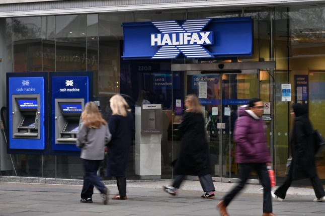 A Halifax bank branch on a high street with shoppers.