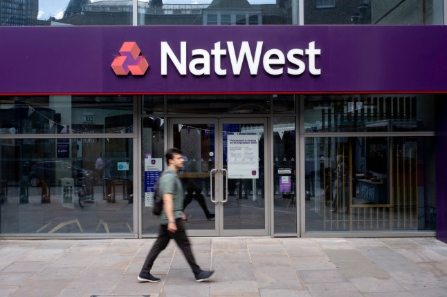 People outside the NatWest Bank in the City of London on 28th July 2024 in London, United Kingdom. National Westminster Bank, commonly known as NatWest, is a major retail and commercial bank in the United Kingdom.